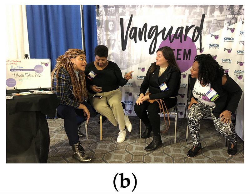 Drs. Keila Miles, Danielle N. Lee, Yaihara Fortiss Santiago, and Jedidah Isler sit facing each other at the VanguardSTEM booth, engaged in conversation.