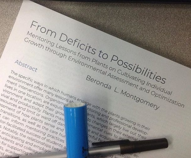 An image of the title page of a journal article entitled, “From Deficits to Possibilities: Mentoring Lessons from Plants on Cultivating Invidual Growth through Environmental Assessment and Optimization.” There is a blue highlighter and a pen laying on the page.